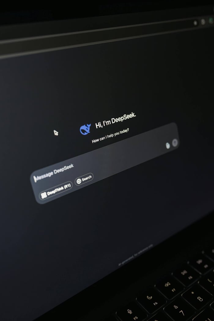 Close-up of a laptop screen displaying an AI chatbot interface with a dark theme.